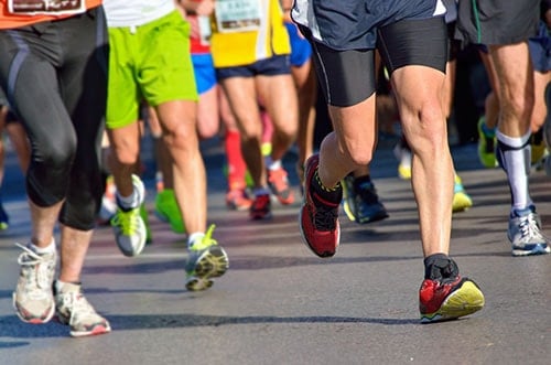 legs of runners in a marathon