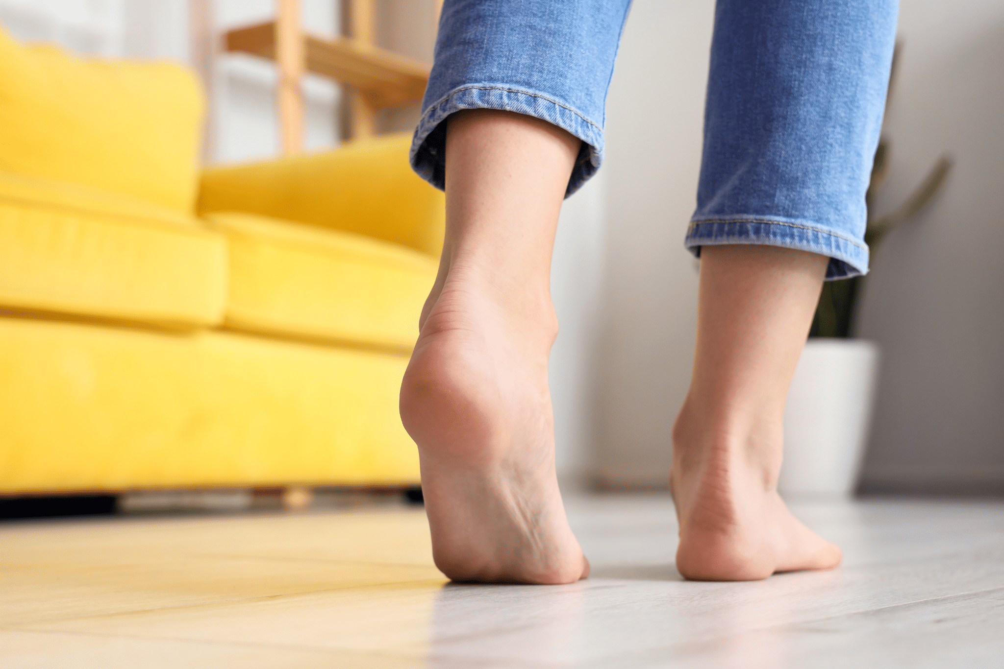 Woman with bare feet at home, closeup